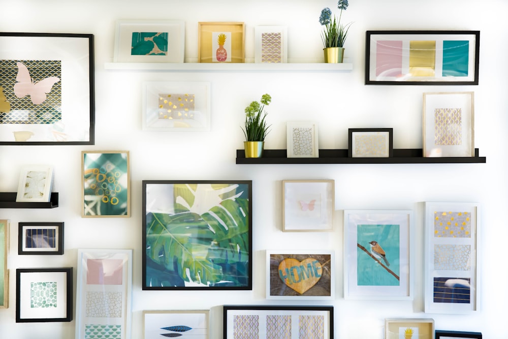 Gallery wall featuring coordinated art frames and statement paintings in a luxurious interior.